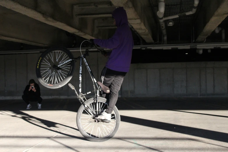 a person balancing on top of a bicycle