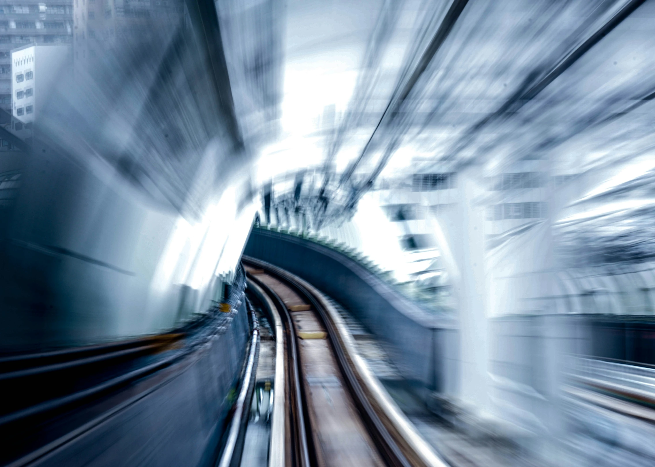 motion blurry pograph of trains in the city