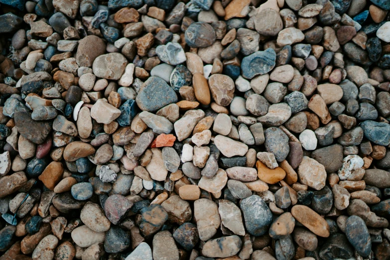 the gravel has some rocks all over it