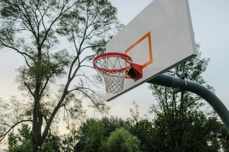 a basketball net has a basketball in it