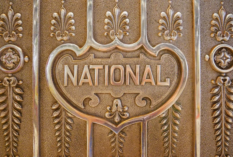 an old fashioned sign reading national on it