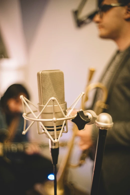 a young person is recording in the studio