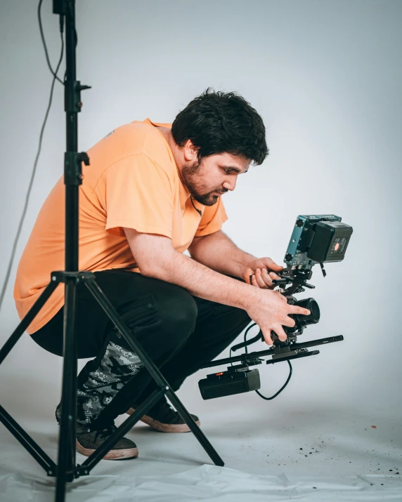 a pographer setting up his tripod to take a po