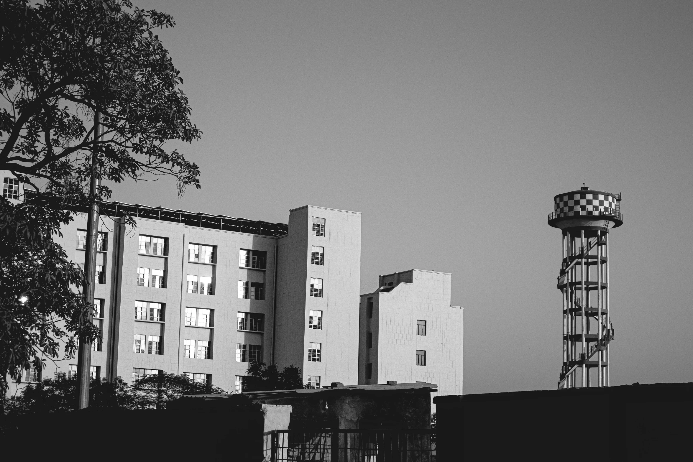 a black and white pograph of tall buildings