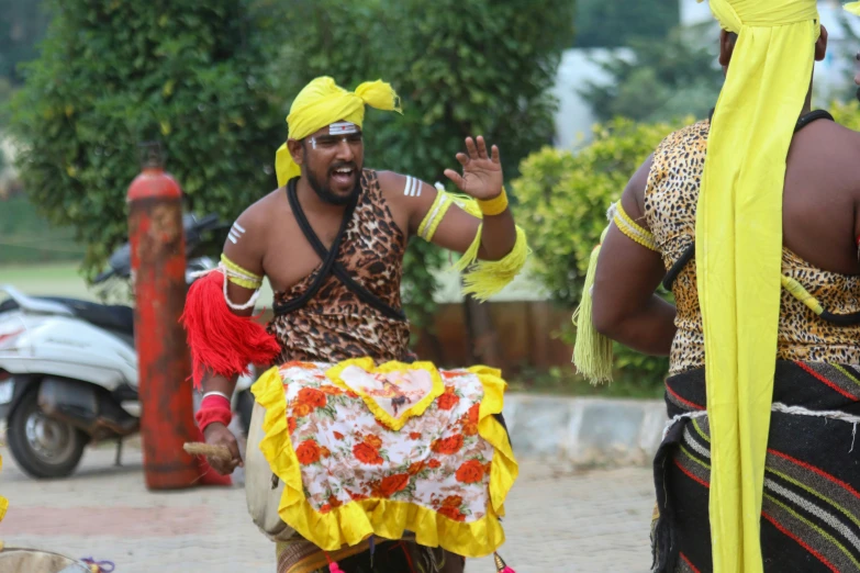 the men dressed in costume stand together near each other