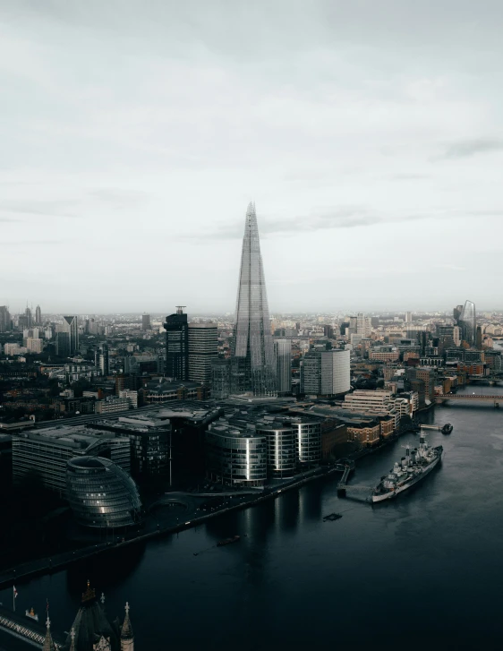 a view of london's skyline and a very big boat