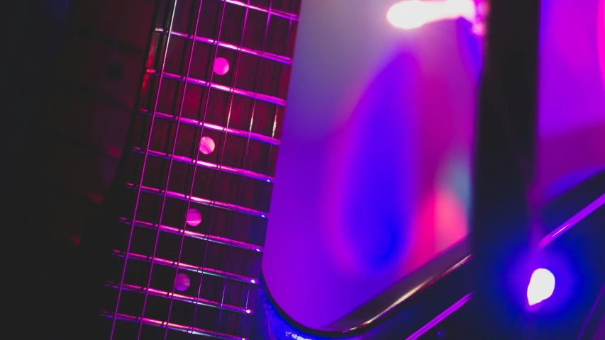 a purple guitar neck in the middle of a room