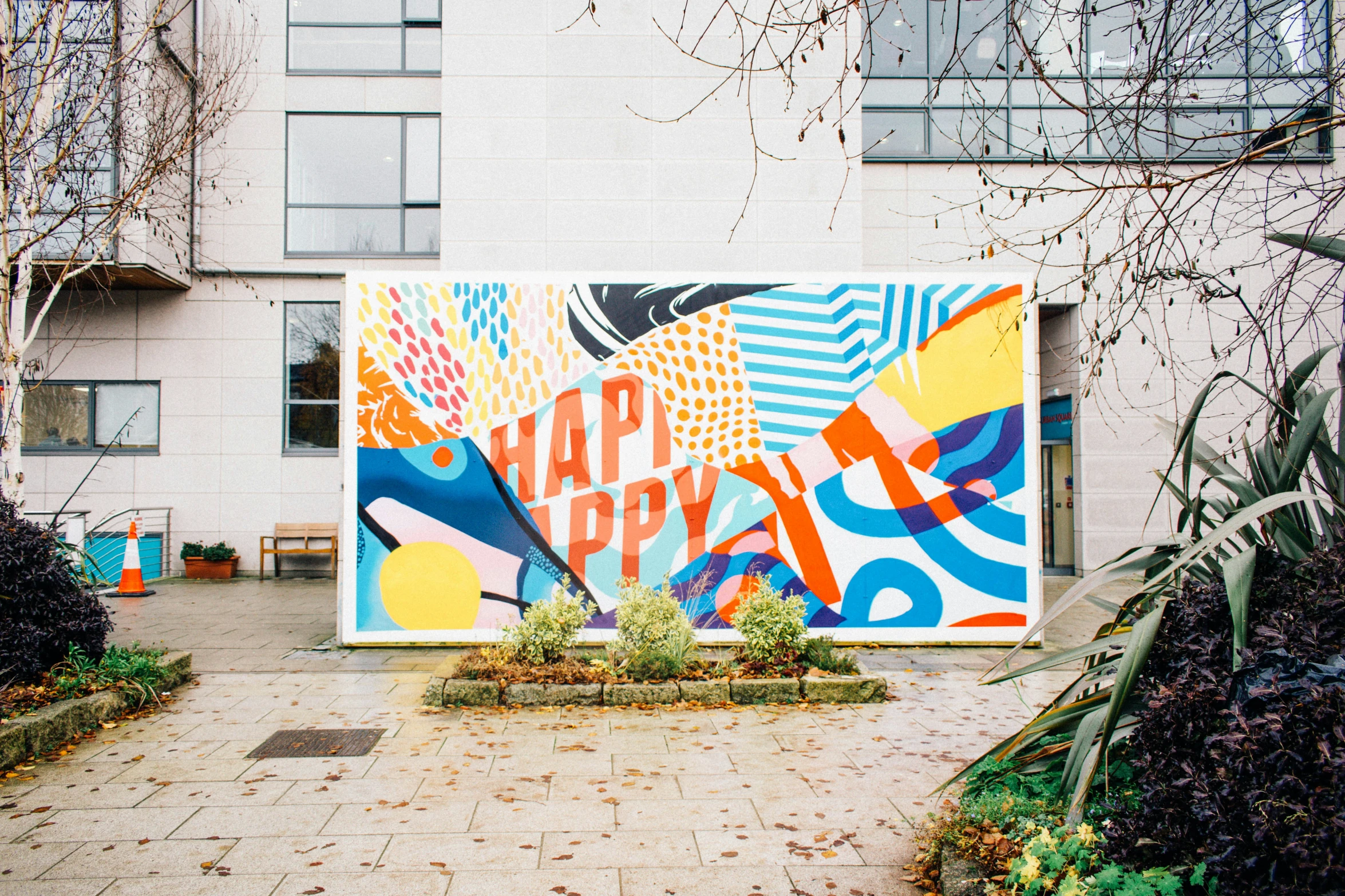 a large poster in the middle of a courtyard