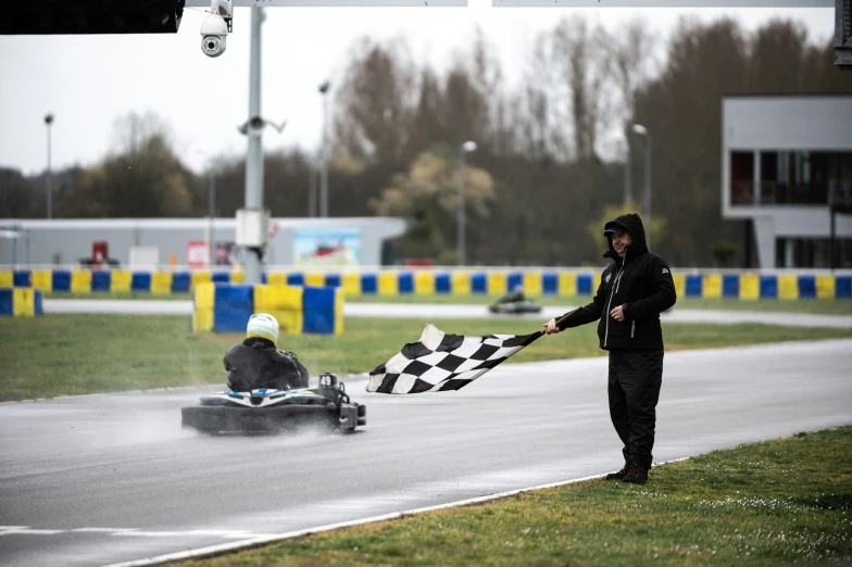 two children race cars on a rainy day