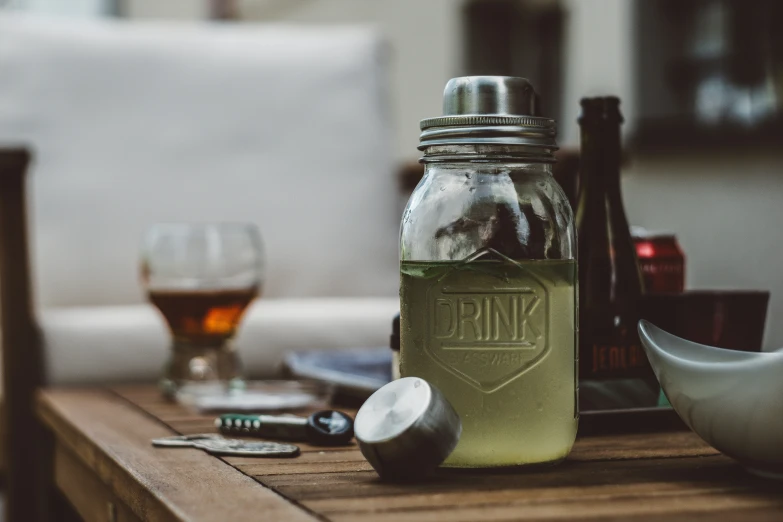 there is a table with a couple of bottles and spoons