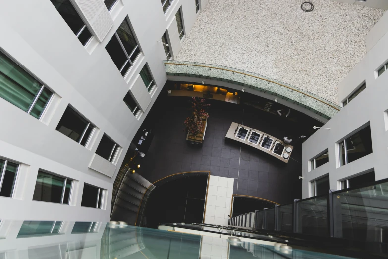 a room in a building with large windows