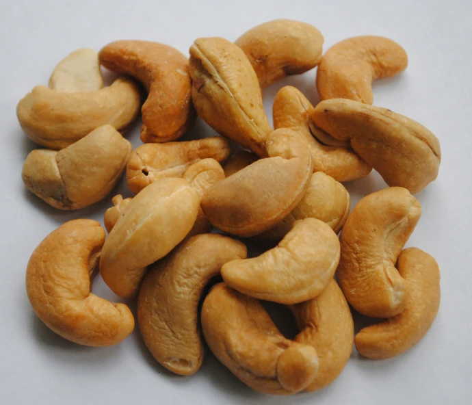 a pile of peanuts nuts with kernels scattered