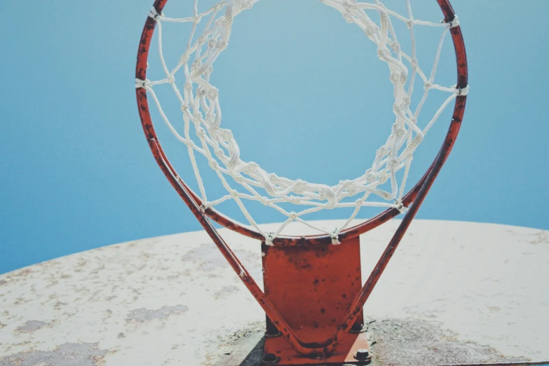 a basketball hoop with a red basketball net attached
