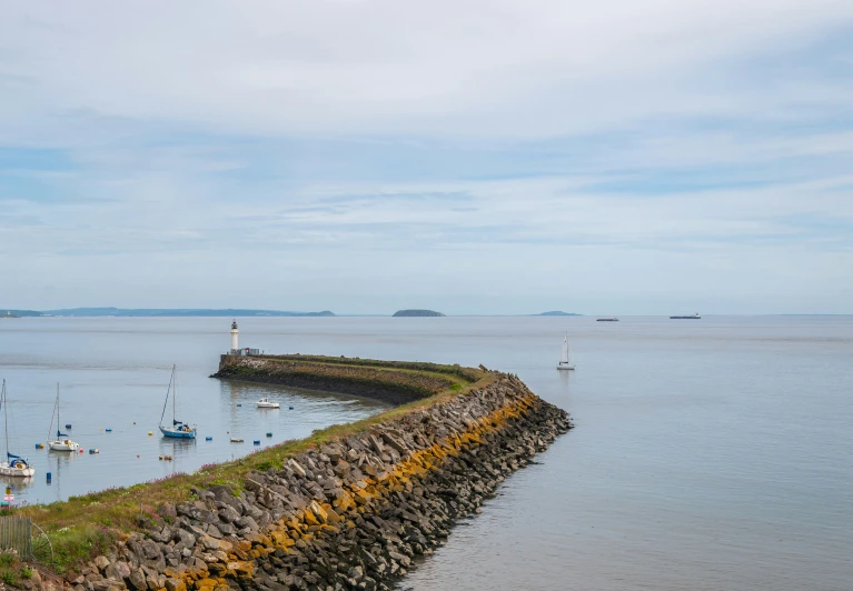 a pier with boats in a large body of water