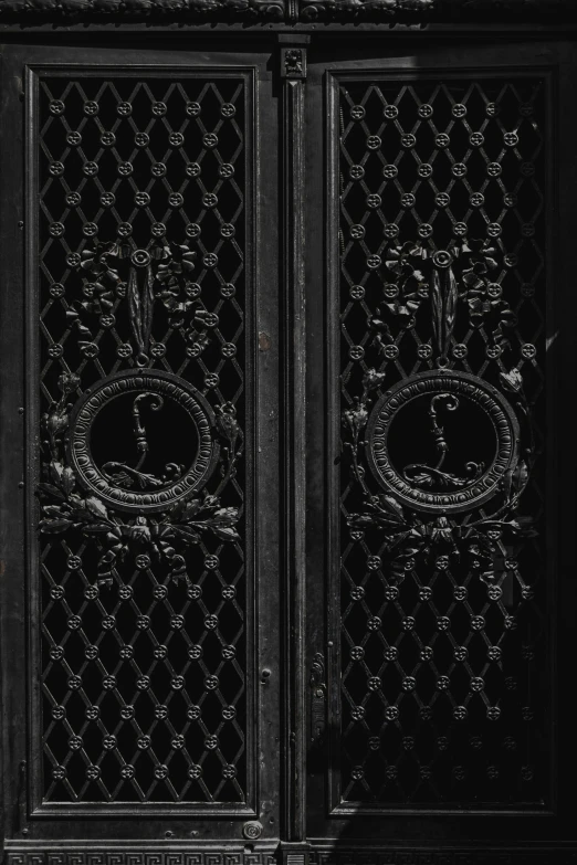 an intricate iron gate is shown with no sign