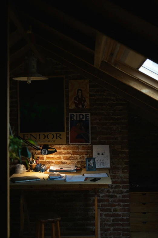 a desk and lamp in a dark room