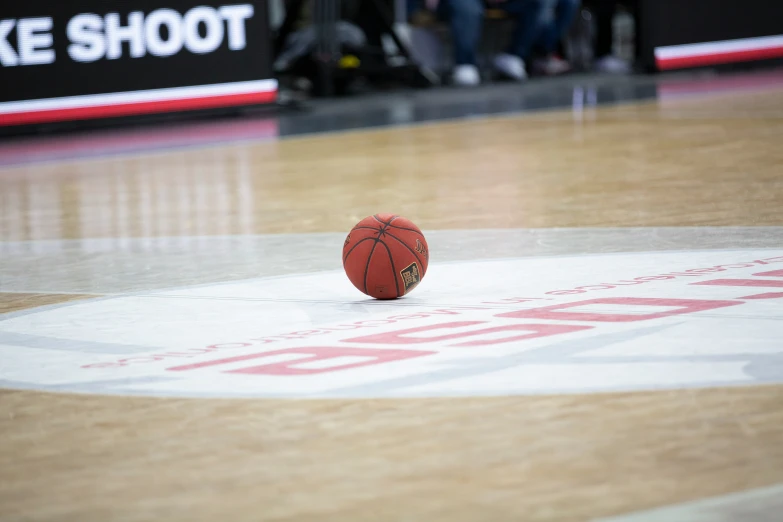 the basketball is resting on the basketball court