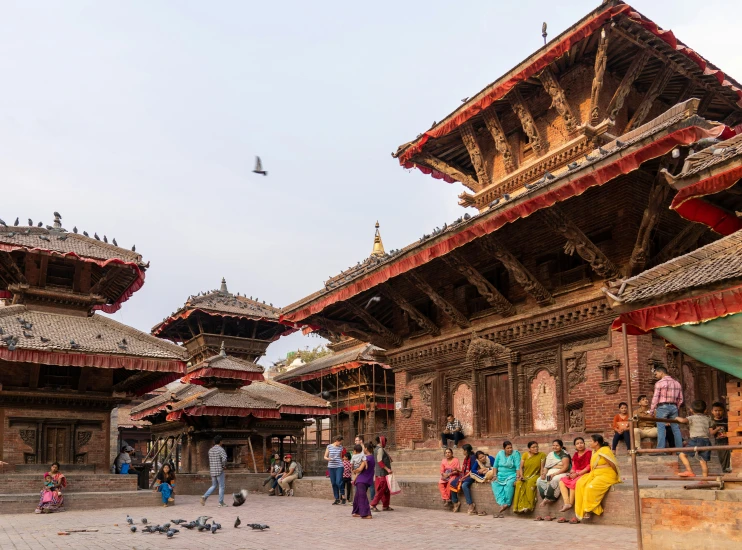 people in different colored sari walking around