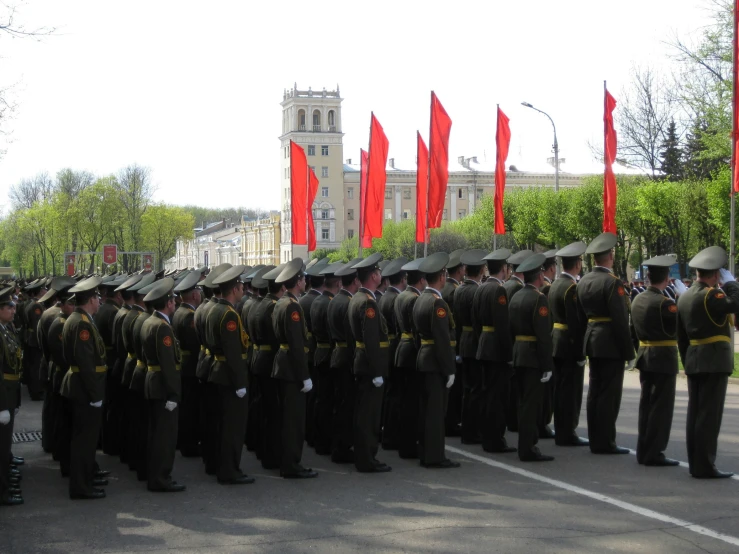 soldiers stand in formation in a military ceremony
