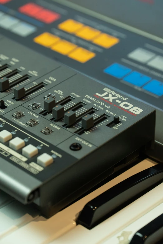 a view of several electronic mixing controls on a desk