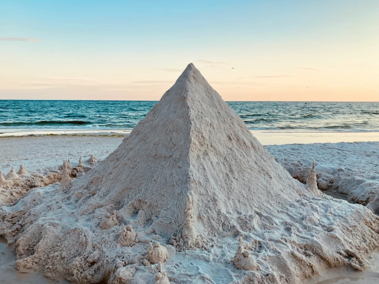 a sand castle is shown on a sandy beach