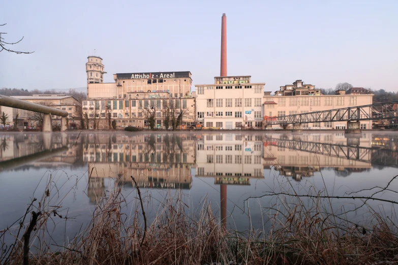 a river with buildings near by in the daytime