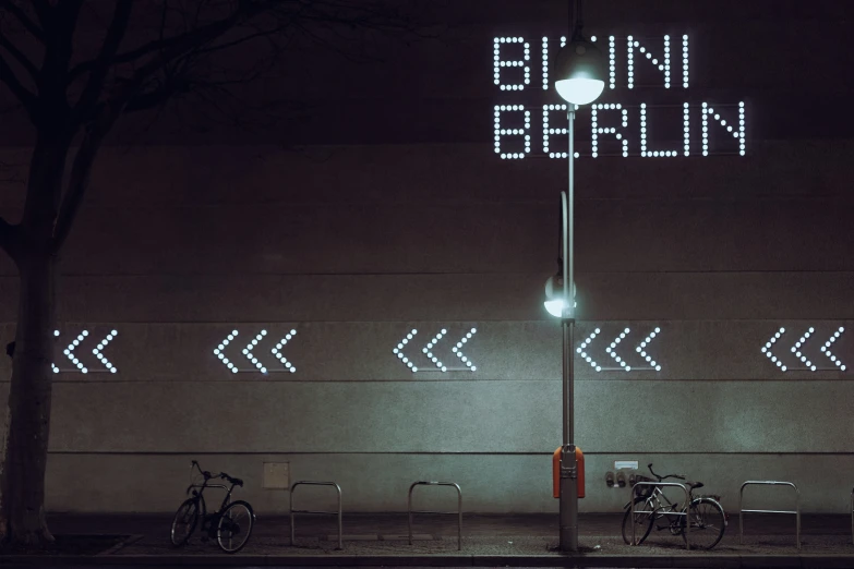 a lighted street sign reads bunn berlin