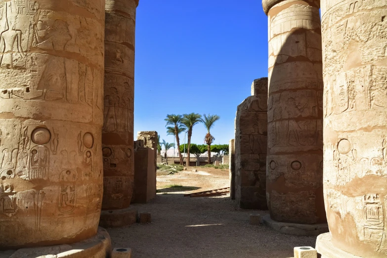 some ancient buildings and pillars in an ancient city