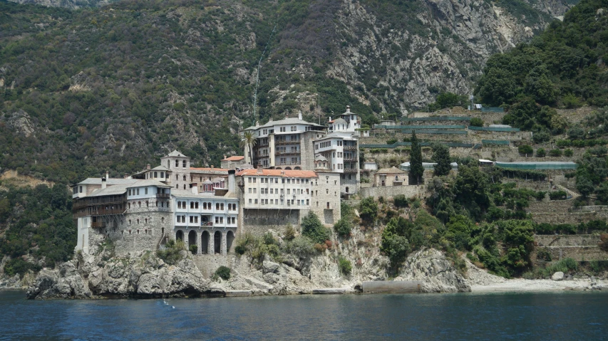 a large old house sitting on top of a hillside