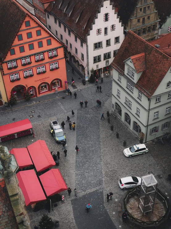 the old town is crowded with people and cars