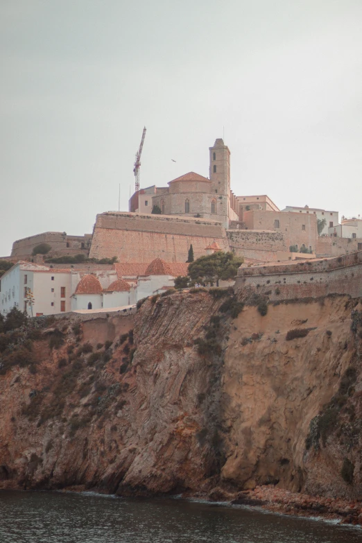 the hillside houses are set on top of a cliff