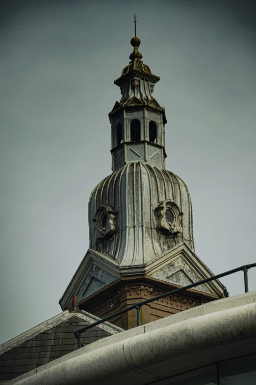 a large building with a tower that has two clocks on the side