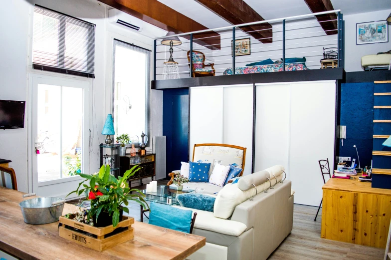 a living room filled with furniture and an open concept