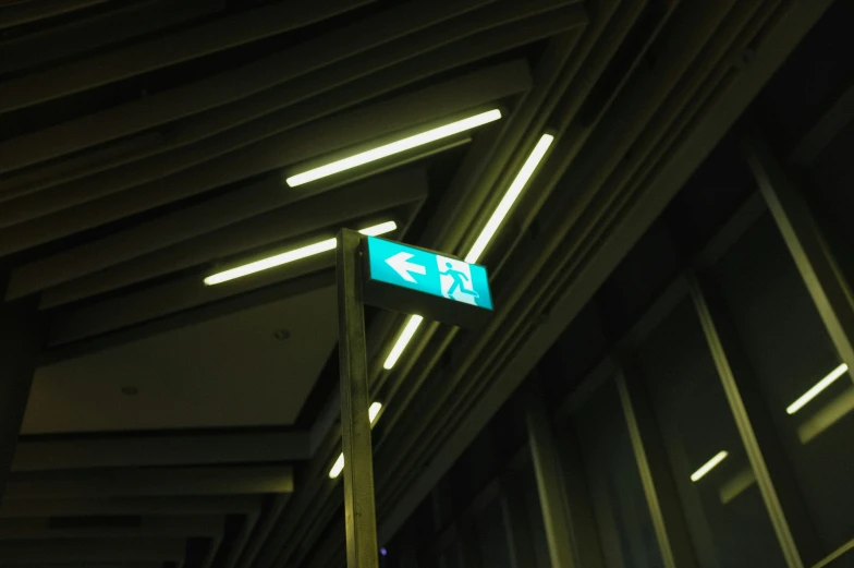 a street sign that is underneath some kind of roof