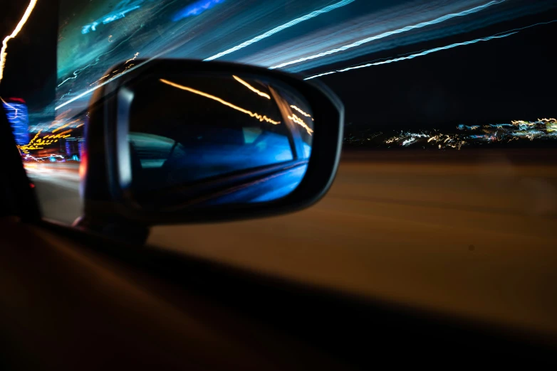 a view from inside a car shows an airplane trail