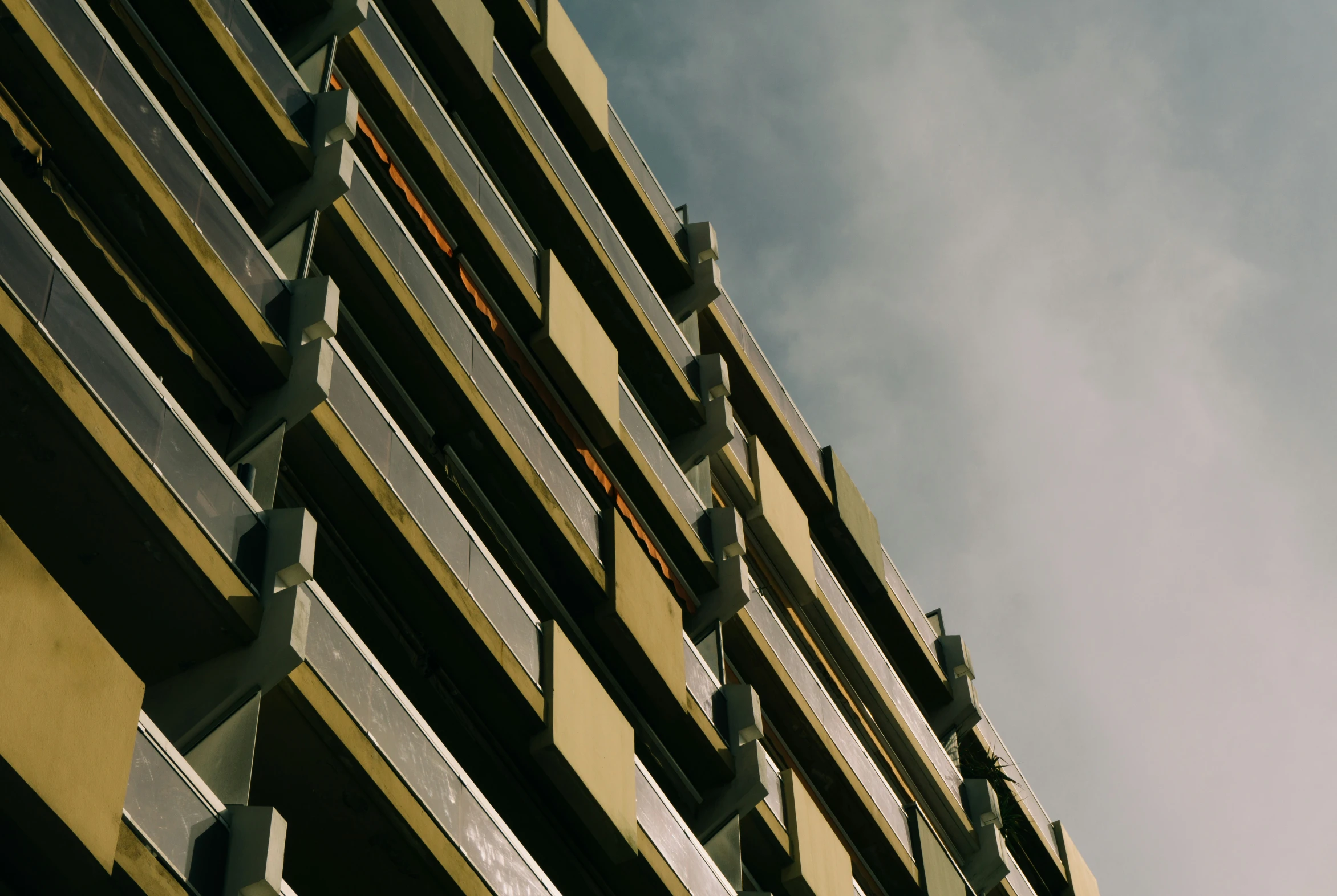 the building has many balconies on the sides