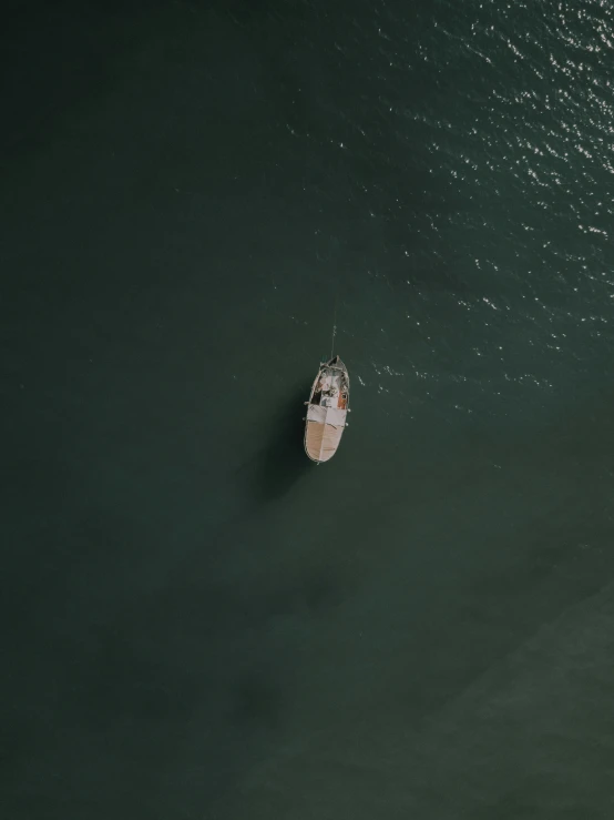 a boat is on the water surrounded by green water