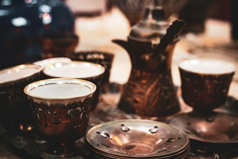 a table is set up with metal ware