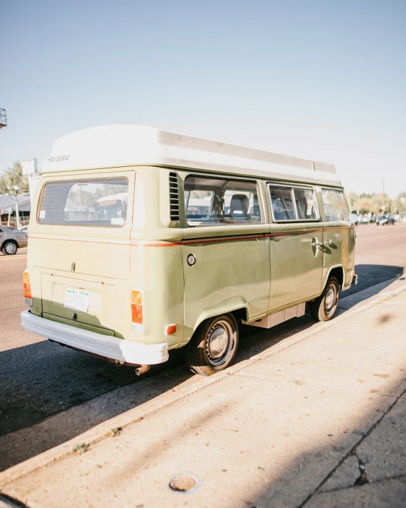 an old school bus sitting in a parking lot