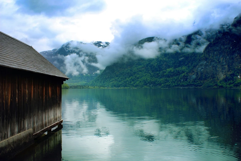 a boat house that is sitting in the water