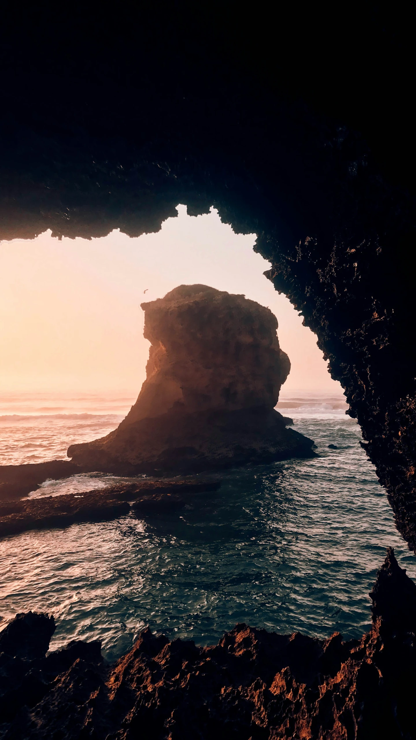 a view from the sea of an ocean cave