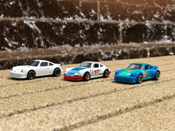 three models of cars are lined up side by side