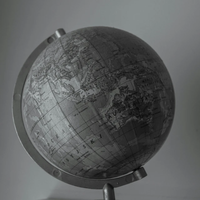 a small wooden globe sitting on top of a table