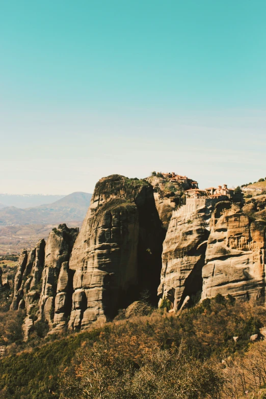 rocks in the landscape with houses on top