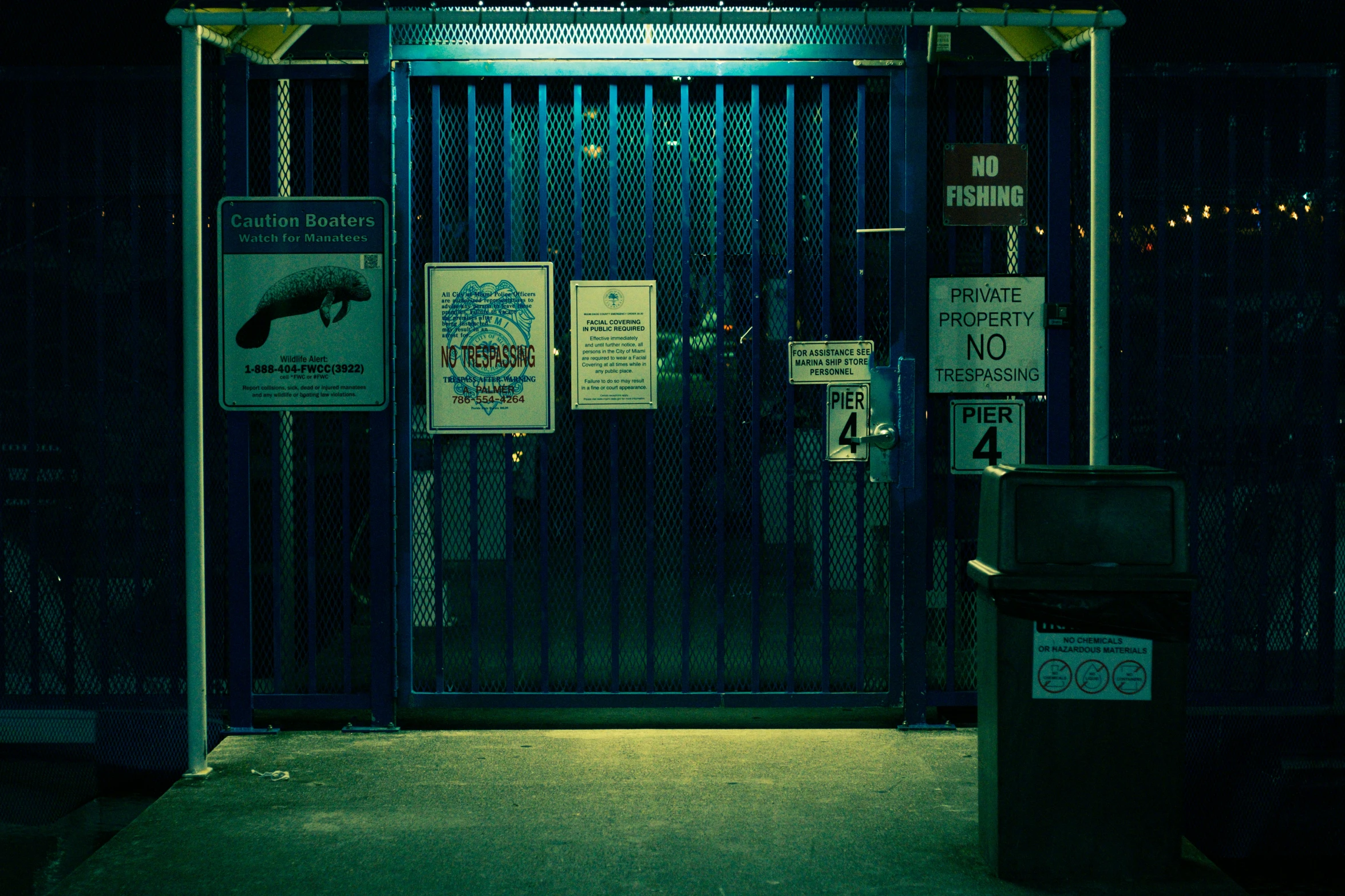 some signs on the bars of an open door