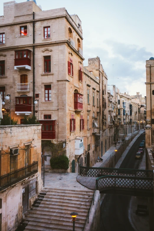 several old buildings on the street with stairs