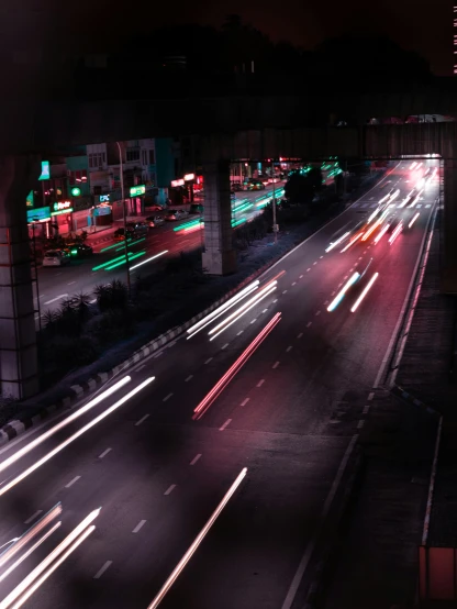 traffic at night is blurry as it moves along the freeway