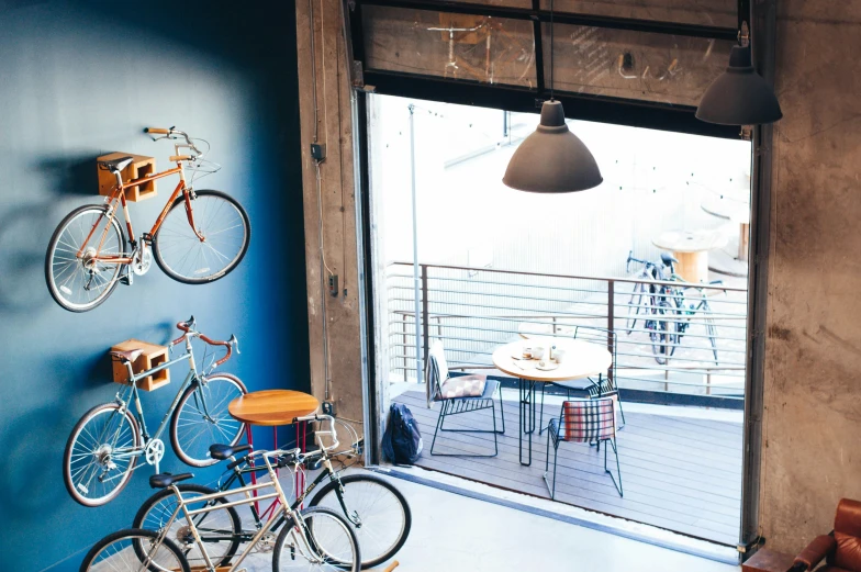 three bikes are parked in front of the patio doors