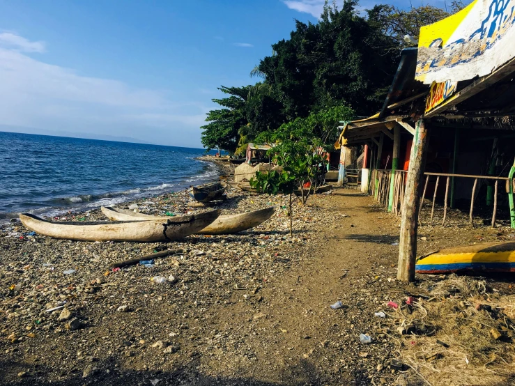 a group of canoes resting on the beach