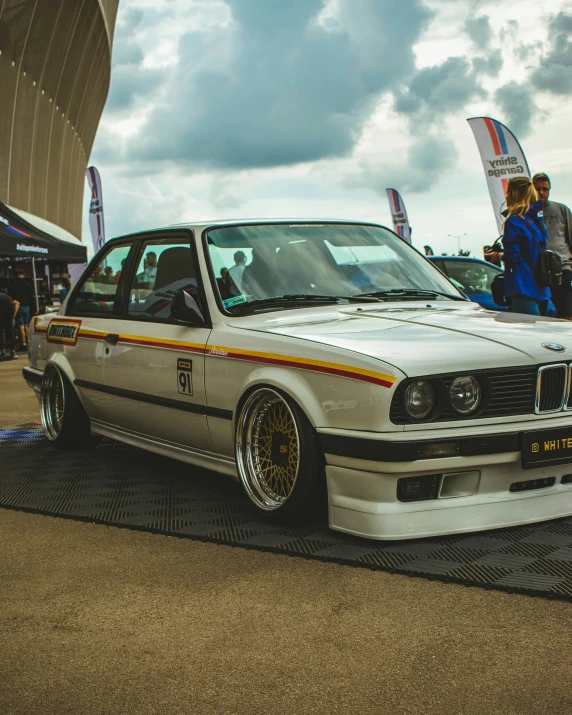 a classic car with a lot of gold rims